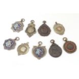 Local Interest : A quantity of assorted fobs to include three hallmarked silver examples, together