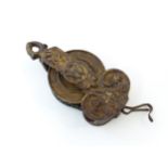 A 19thC French cast pulley with sprung chain mechanism, with traces of gilt detail. Approx. 7 1/2"