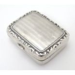 A Continental .830 silver pill box with engine turned decoration and gilded interior. 1 3/8" x 1"