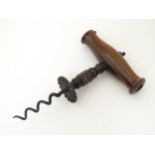 Kitchenalia: a Victorian Henshall type corkscrew, with steel shank and walnut handle,