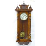 Gustav Becker : A 19th century walnut twin weight Vienna wall clock by Gustav Becker with 8" dial,