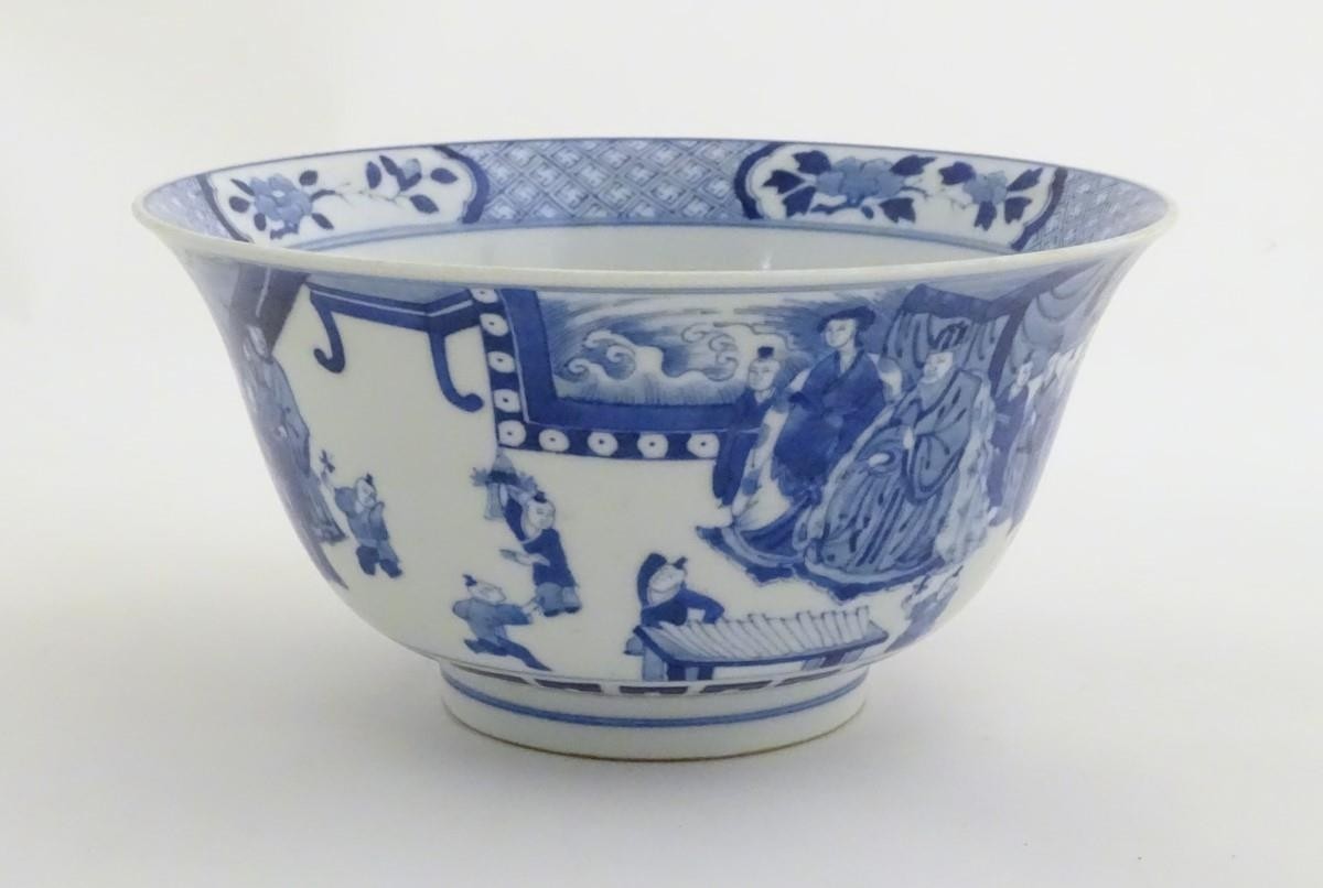 A Chinese blue and white footed bowl with a flared rim, decorated with a scene depicting the - Image 7 of 8