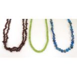 Three various bead necklace to include one of turquoise coloured beads, another of garnet coloured