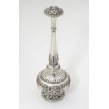 A white metal rose water sprinkler with acanthus scroll detail. Approx. 8 1/2" high Please Note - we