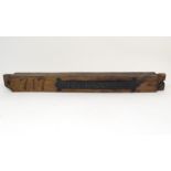 A 20thC cast plaque for Freidenstal, mounted on an oak beam incised 717. Approx. 35 1/2" long