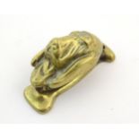 An early 20thC brass door knocker modelled as a dog / hound. Approx. 3" high Please Note - we do not