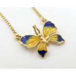 A necklace with butterfly pendant with enamel decoration. The chain stamped 750. Approx 15" long