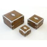 A mid to late 20thC nest of three boxes with banded detail. Largest approx. 3 3/4" x 6" x 6"