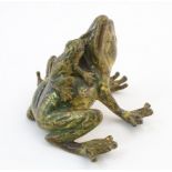 A cold painted bronze model of a seated frog with a froglet on its back. Approx. 1 3/4" high