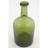 An olive glass bottle with spout to lip. 8 1/2" high Please Note - we do not make reference to the