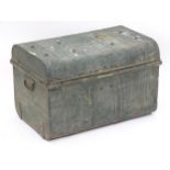 A late 19thC / early 20thC tin trunk flanked by carrying handles. 24" long x 15" wide x 15 1/2"