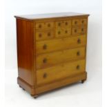A late 19thC mahogany chest of drawers with a rectangular moulded top above one deep central