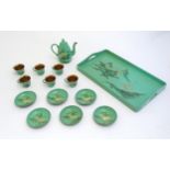 A Japanese dolls green lacquer coffee wares comprising coffee pot, six cups and saucers and a
