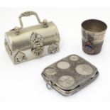 Three silver plate items comprising a coin holder, small box of casket form and an oversized thimble