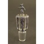 A glass decanter stopper with silver mounts bearing import hallmarks for Sheffield 1903, Thomas