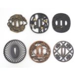 Six assorted Japanese tsuba / sword hand guards, variously decorated with tigers, oxen, sage and