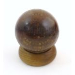 A 19thC Dark Lord's Ground presentation cricket ball / trophy, with gilt text: Harcourt C. C.