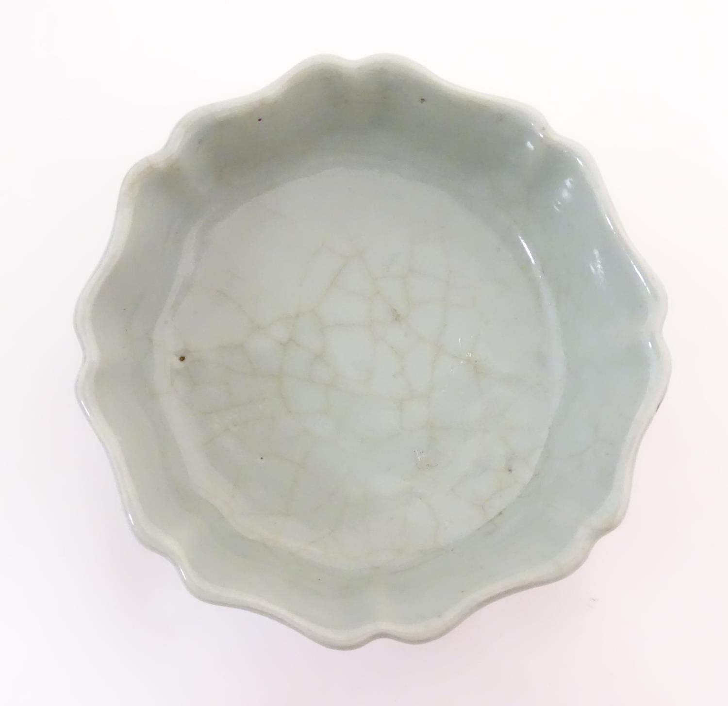 A Chinese celadon brush wash pot with a scalloped edge. Character marks under. Approx. 1 1/2" high x - Image 4 of 5