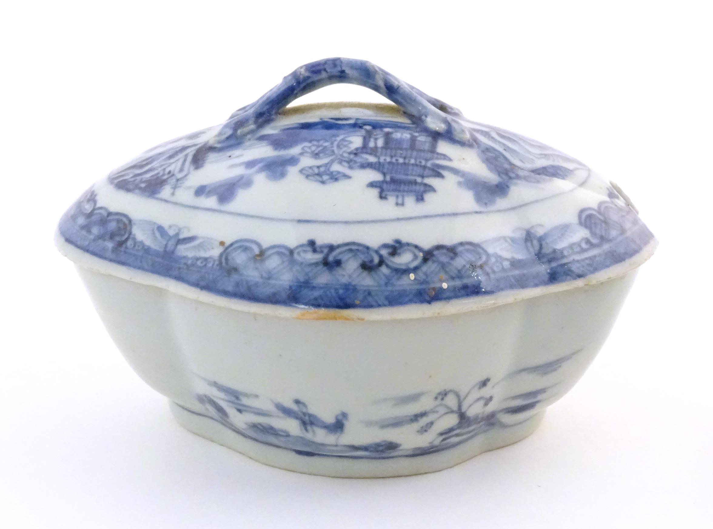 A Chinese blue and white soup tureen of quatrefoil form decorated with a landscape scene with pagoda - Image 7 of 9