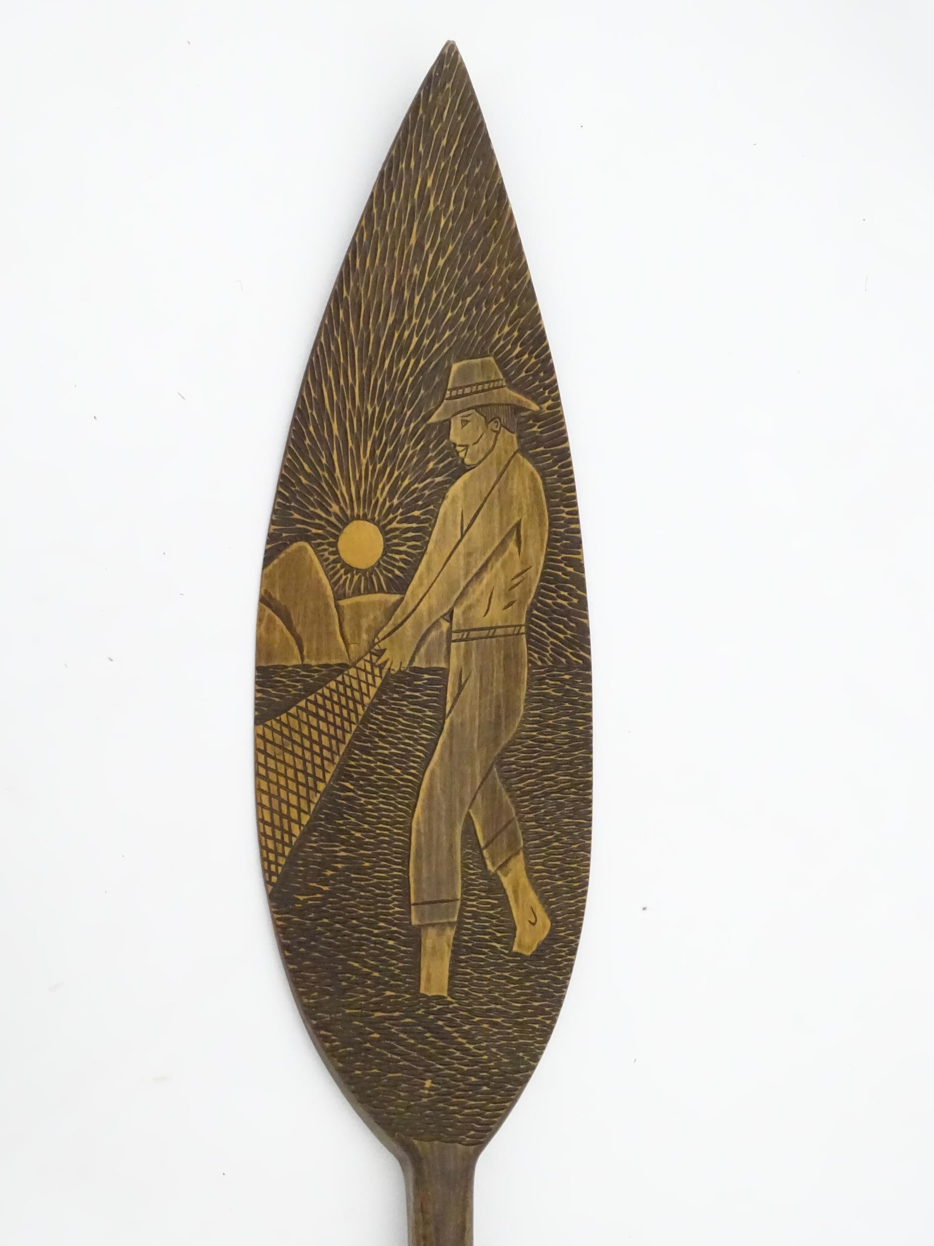 A Brazilian boat oar / paddle with carved decoration a man fishing with a net. Ascribed 'Itatiaia, - Image 5 of 8