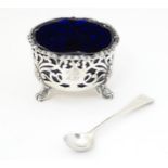 A Victorian silver mustard with blue glass liner, hallmarked London 1850, maker Edward John