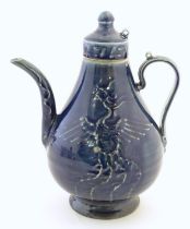A Chinese pear shaped teapot with phoenix bird decoration to body. Approx. 8 3/4" high Please Note -