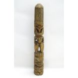 Ethnographic / Native / Tribal: A hardwood carving depicting stylised figures, with traces of