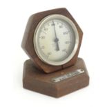 A 20thC desk thermometer / Rototherm by Corfield Ltd, London. Pat. No. 378314. The hexagonal teak