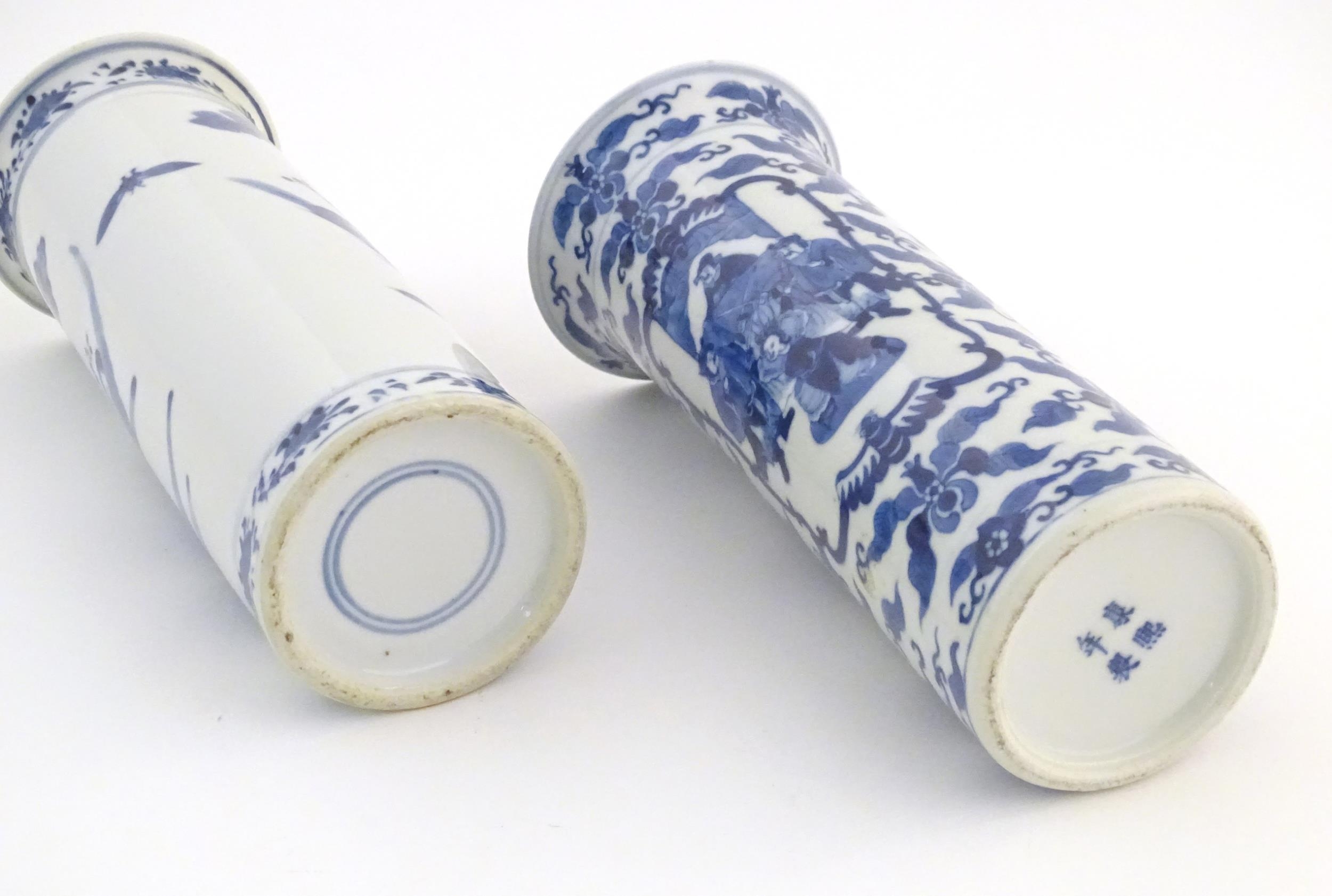 Two Oriental blue and white vases of cylindrical form, one depicting figures in a garden scene - Image 2 of 6