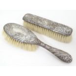 Two Victorian silver backed brushes, one hallmarked Birmingham 1899, maker James Matthews, the other