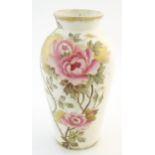 A Royal Bonn vase of baluster vase decorated with flowers and foliage. Marked under. Approx. 11 1/4"
