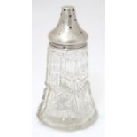 A glass sugar sifter / caster with silver top. Approx. 5 1/4" high Please Note - we do not make