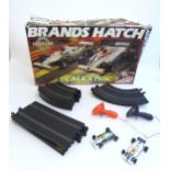 Toys: A Brands Hatch scalextrics set to include Parmalat Brabham BT49, Saudia Leyland Williams