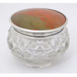 A cut glass dressing table jar with silver mounted lid hallmarked Birmingham 1925 maker W