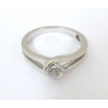An 18ct white gold ring set diamond solitaire. Ring size approx. M Please Note - we do not make