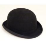 Vintage fashion accessory: A Christys' London black bowler hat, size 7 1/4 Please Note - we do not