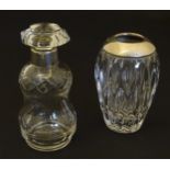 A cut glass scent / perfume bottle with silver collar hallmarked Birmingham 1902 together with a cut