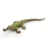 A cold painted bronze model of a lizard. Approx. 3" long Please Note - we do not make reference to