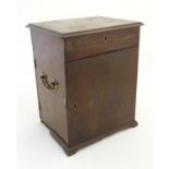 A 19thC mahogany medicine box / travelling apothecary case with twin brass handles, a hinged lid,