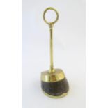 A late 19th / early 20thC brass door stop / door porter with horse hoof base. Approx. 14" high