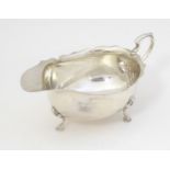 A silver sauce boat hallmarked Birmingham 1930, maker Adie Brothers Ltd., retailed by Bruford,