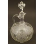 A glass ewer / jug with etched decoration, loop handle and associated stopper 9 1/2" high Please
