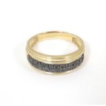 A 9ct gold ring set with black diamonds in a double linear setting. Ring size approx. U 1/2 Please