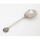 An Arts and Crafts silver spoon with lion head detail to top, hallmarked London 1923, maker The