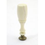 A 19thC hand seal with a turned ivory handle. Approx. 2 3/4" high Please Note - we do not make