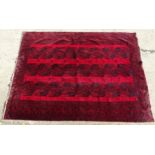 Carpet / Rug : A Turkoman rug, the red ground with bands of medallions and geometric motifs