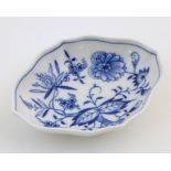 A Continental dish of lozenge form with blue and white decoration depicting flowers and foliage.