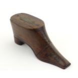 A Victorian treen vesta case modelled as a shoe with stud detail, the sliding lid with match