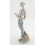 A Lladro figure, The Clown in Love model no. 6997. With original box. Approx. 14" high Please Note -