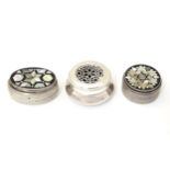 Three various silver and white metal pill boxes, two with mother of pearl mosaic inset lids